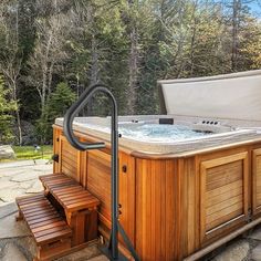 a hot tub sitting on top of a stone patio