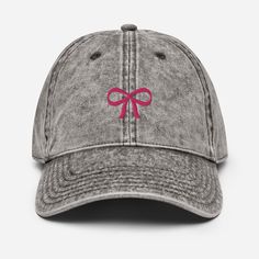 Elevate your everyday look with our Coquette Bow Embroidered Baseball Hat! This hat makes a great tie the knot bridal shower favor or bachelorette party hat. Crafted with style and sophistication in mind, this hat features a beautifully embroidered coquette bow design on the front, adding a touch of elegance to your casual attire. Made from high-quality materials, this hat offers both comfort and durability, making it perfect for outdoor adventures, errands around town, or simply adding a stylis Bachelorette Party Hat, Pretty Hats, Embroidered Baseball, Coquette Bow, Summer Hat, Party Hat, Bow Design, Cute Hats