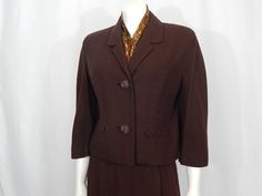 "This looks late 50s when the more boxy styles were coming in vogue Check out the buttons! There is top stitching on the jacket  The brown is rich and the crepe is wonderful The scarf was attached to the jacket when we found it Jacket is fully lined, the front of the skirt is lined as well Part of an estate that wanted their fashion to be appreciated and loved again Everything I found was and have listed from this estate was dry cleaned back in the day and hung with no age spots when I found them Condition- great- no fading, holes or open seams Shown on a woman's size 6 mannequin  Most like a current Small based on the 28\" waist, so here are the measurements laying flat (double measurements for bust, waist and hips): Jacket  Shoulder seam to seam 16\" Bust 21\" Waist 20\" Shoulder to wais Bracelet Sleeve, Womens Suits, Jacket Blazer, Top Stitching, Suits For Women, Blazer Jacket, Women's Blazer, Vintage Ladies, Pencil Skirt