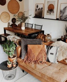 a living room filled with lots of furniture and decor