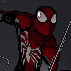 a spider - man is standing in the dark with his arms out