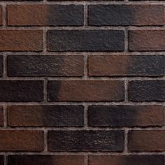 a brick wall that is brown and black