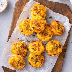 mini cheesy bread muffins on a cutting board