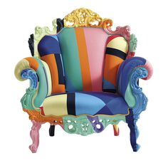 a colorfully decorated chair sitting on top of a white floor