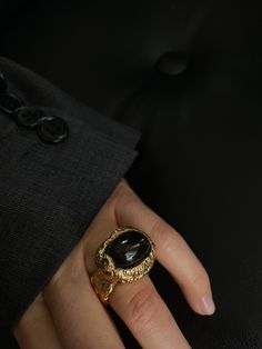 Elevate your jewelry collection with our exquisite 24k gold plated massive exceptional statement handmade coctail ring with onyx. Each detail has been carefully considered and expertly crafted by hand to create a truly stunning piece of jewelry. The ring's centerpiece is a large, bold onyx stone that radiates elegance and sophistication. Onyx is known for its unique properties, believed to provide strength and support during challenging times. Combined with the lustrous 24k gold plating, this ring is a beautiful contrast of rich hues that will complement any skin tone. Wear this ring to make a statement and turn heads at any special occasion, or simply as an everyday accessory to add a touch of glamour to any outfit. Its durable and long-lasting construction ensures that you can cherish an Luxury Onyx Jewelry For Weddings, Luxury Onyx Rings For Formal Occasions, Onyx Open Ring For Formal Occasions, Gold Onyx Rings For Wedding, Formal Onyx Open Ring Jewelry, Gold Onyx Wedding Rings, Gold Onyx Ring Perfect As A Gift, Gold Onyx Ring As A Gift, Gold Onyx Ring Perfect For Gifts