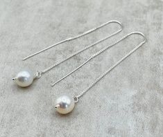 "Precious baroque white keshi pearls suspending from a 925 sterling silver threader. LENGTH: 2.8 inches - 7 cm long - 4,2 gr. each Pearls: 7 x 9 mm These dainty earrings are also available in 24 K Gold Vermeil https://www.etsy.com/uk/listing/1016226928/gold-vermeil-threaders-with-baroque?ref=shop_home_active_16&pro=1&frs=1 MATERIALS: 925 Sterling Silver Baroque pearls: Pearl signifies faith, charity and innocence. It enhances personal integrity and helps to provide a focus to ones attent Sterling Silver White Pearl Chain Earrings, Sterling Silver White Pearl Earrings With Pearl Chain, White Sterling Silver Pearl Chain Earrings, Sterling Silver Pearl Chain Earrings For Gift, Gift Pearl Chain Earrings In Sterling Silver, Gift Sterling Silver Pearl Chain Earrings, Jewellery Minimalist, Personal Integrity, Dainty Jewellery