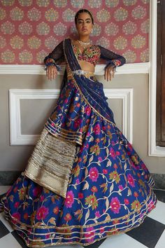 Dark blue lehenga with floral printed motifs, attached drape on the side and gota patti trims. Comes with floral embroidered blouse, organza dupatta and meenakari belt.
Components:4
Pattern:Print and Embroidery
Type of Work:Floral Print, Zari, Gota Patti, Beads, Cutdana and Resham
Neckline:V neck
Sleeve Type:Cold Shoulder
Fabric:Silk and Organza
Color:Blue
Other Details:
Blouse with cutwork detail and fringe on the sleeve hems
Lehenga with attached cancan
Padded blouse
Cold shoulder sleeves
Gota Festive Floral Print Traditional Drape Sets, Festive Sets With Floral Print In Traditional Drape, Festive Floral Print Sets With Traditional Drape, Festive Sets With Floral Print And Traditional Drape, Traditional Blue Lehenga With Floral Print, Blue Anarkali Lehenga With Floral Print, Traditional Blue Floral Print Lehenga, Blue Bollywood Lehenga With Floral Print, Reception Sharara With Floral Print, Traditional Drape