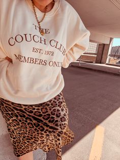 Join the exclusive Couch Club with our Old Money Vibes sweatshirt! Featuring "Couch Club" graphics and soft fleece lining, this cream-colored sweatshirt with brown embroidery is perfect for lounging in style. Touch it to believe it. Model: Kylie, wearing size 2X Model: Jordin, wearing size Large Beige Letter Print Sweatshirt For Fall, Cream Letter Print Sweatshirt For Loungewear, Beige Letter Print Sweatshirt For Loungewear, Relaxed Fit Cream Sweater With Letter Print, Brown Embroidery, Colorful Sweatshirt, Top Graphic Tees, Accessories Jacket, Equatorial Guinea