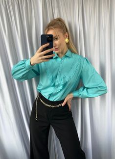 The turquoise color is a beautiful and vibrant shade that is perfect for adding a pop of color to any outfit.  When styling this blouse, you can pair it with a variety of different items to create a chic and sophisticated look. For example, you could wear it with a pair of high-waisted trousers or a pencil skirt for a more formal occasion. Alternatively, you could pair it with a pair of jeans and some cute flats for a more casual look. - Good vintage condition (no visible sings of wear) - TAG SI Trendy Light Blue Summer Blouse, Elegant Solid Color Summer Shirt, Trendy Solid Color Blouse, Trendy Solid Color Spring Blouse, Trendy Solid Color Blouse For Spring, Summer Ruffled Shirt, Trendy Solid Blue Blouse, Elegant Summer Shirt With Ruffles, Chic Fitted Shirt With Ruffled Collar