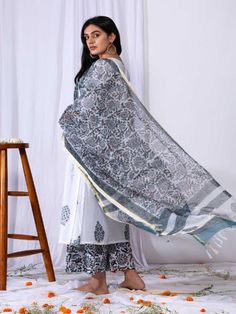 This suit set comes with a double dori neck detailing and a front long panel with borders. Pair it with a matching palazzo and handblock printed dupatta for a complete elegant look this summer. 100% Premium Cotton Printed Suit Set Chanderi Dupatta Comfort fit Set Contents: 1 Kurta, 1 Dupatta, 1 Palazzo Model height is 5.7 feet and is wearing size M Wash Care Instructions: Dry Clean Only Note: The product will be delivered within 15-20 days of the order placed. The product can be made on order, i White Chanderi Block Print Set, White Chanderi Kurta With Block Print, White Block Print Chanderi Set, White Chanderi Sharara With Printed Motifs, White Chanderi Palazzo Set With Block Print, Bohemian White Palazzo Set With Dupatta, White Cotton Sharara With Sheer Dupatta, Unstitched White Bohemian Palazzo Set, White Anarkali Palazzo Set With Block Print