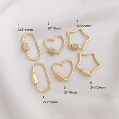 five pieces of gold metal with hearts and stars on each side, all in different sizes