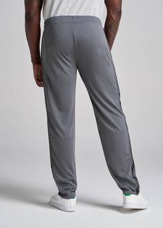 About Our Tall Men's Pants These men's tall athletic pants are a classic take on an athleisure essential. When it comes to athleisure, a good fit is key. You need something that's comfortable enough to relax in yet capable enough to work out in – but as a tall guy, it can be hard to find options that work for your height. You either have to compromise on a baggy fit or settle for lengths that are way too short. Not anymore. We know how hard it is to find quality styles when you're tall, which is Solid Moisture-wicking Sportswear Pants, Sporty Solid Moisture-wicking Pants, Full Length Moisture-wicking Pants For Sports, Moisture-wicking Full-length Training Pants, Solid Go-dry Pants For Jogging, Solid Color Sportswear Pants For Sports, Sporty Solid Color Training Pants, Sporty Training Pants In Solid Color, Relaxed Fit Solid Bottoms For Training