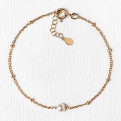 description This dainty bracelet is minimal and elegant. Features a Freshwater pearl wirewrapped onto an Italian bead chain. Beautifully packaged with our signature box, this will be a gift your bridesmaid will love and want to wear everyday! end description materials Available in: .925 Sterling Silver / Gold Vermeil / Rose Gold Vermeil Fresh Water Pearl, 3mm (natural pearl sizes vary slightly) Hypoallergenic, lead, and nickel free end materials details Length: 6.25in (16cm) + Extension: 1in (2. Bridal Bracelets, Circle Bracelet, Back Necklace, Dainty Bracelet, Back Jewelry, Bridesmaid Bracelet, Jewelry Bridal, Crystal Chain, Bridal Bracelet