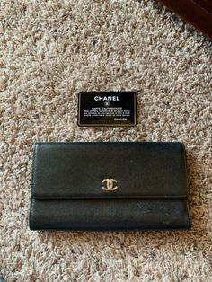 Authentic Chanel trifold, soft leather wallet. Condition is "Pre-owned". Shipped with USPS First Class. Minor “wear and tear” on some of the leather (as shown).  Authenticity card included. Wear And Tear, Trifold Wallet, First Class, Snap Closure, Soft Leather, Leather Wallet, Women's Accessories, Black Color, Shoe Accessories