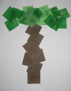 an art project made out of tissue paper with green trees on top and brown squares in the middle