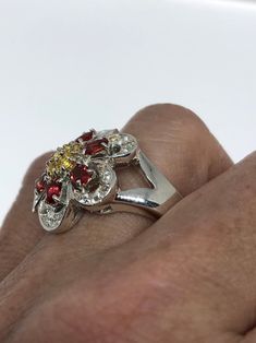 Genuine red Bohemian Garnet set with golden citrine The setting is handcrafted in Sterling silver size 10.25 Can be sized. My jeweler charges $10-$20. All rings are shipped in a nice gift box. Check out our over a THOUSAND great reviews Engraving is $4 per letter and is not always perfect depending on the piece. It can take a few days if the jeweler is busy. This is payable to Paypal Judithsltd@gmail.com Red Sterling Silver Flower Ring For Anniversary, Anniversary Red Flower Ring In Sterling Silver, Vintage Flower-shaped Gemstone Jewelry, Vintage Flower Gemstone Jewelry, Vintage Flower-shaped Multi-stone Jewelry, Silver Multi-stone Flower Ring For Anniversary, Silver Flower Ring, Sterling Silver Flowers, Flower Ring