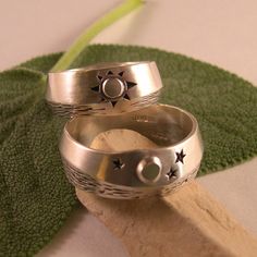 "There is nothing like seeing the moon's glint off water on a peaceful night, and in the morning...the sun is shining. Like Yin and Yang, night and day work together in a circle of life. What wonderful symbols for wedding bands! These rings have a soft brush finish, but could also be done in high polish. I have used oxidation, or antiquing to bring out the details. The width varies slightly in the design of both rings, which gives a truely custom feel. Both rings measure in width about 5/16\" wi Spiritual Sun And Moon Design Promise Ring, Celestial Rings With Sun And Moon Design For Promise, Celestial Promise Rings With Sun And Moon Design, Celestial Sun And Moon Design Promise Rings, Celestial Rings With Sun And Moon Design For Anniversary, Celestial Sun And Moon Design Rings For Anniversary, Mystical Moon Phase Ring For Anniversary, Mystical Sun And Moon Design Jewelry For Wedding, Spiritual Wedding Rings With Sun And Moon Design