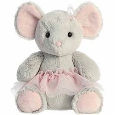 a gray stuffed animal with pink ears and tutu skirt sitting on a white background