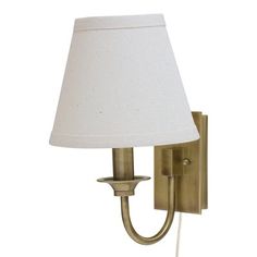 a wall light with a white shade on it