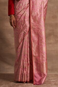 Pink handloom saree with Kadhua work, intricate zari work crafted using the Ektara weave and fringe border.
Components:1

Fabric:Base Fabric Pure Silk
Color:Pink
Crafts used Vaskat, Ektara, Jaal and Kadhua
Note: Blouse worn by the model is not for sale - Aza Fashions Festival Banarasi Silk Pre-draped Saree With Tilla, Elegant Pre-draped Saree With Tilla For Diwali, Fitted Pre-draped Saree With Zari Weaving For Puja, Zari Weaving Lehenga For Puja, Elegant Tilla Pre-draped Saree With Traditional Drape, Elegant Pre-draped Saree With Tilla In Traditional Drape, Elegant Pre-draped Saree With Tilla Embroidery, Elegant Pre-draped Saree For Festivals With Tilla, Elegant Tilla Pre-draped Saree