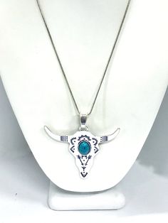 "This beautiful silvertone necklace would make the perfect complement to your southwestern style outfit! It also serves as a reminder to always \"grab the bull by the horns\". The pendant measures approx. 2 3/8\" by 2 13/16\" and has a simulated turquoise center. This necklace is available on a silver-plated snake chain in your choice of 16, 18, 20, 22, 24, 26, 28 or 30 iInches. Each item comes individually boxed and ready to give as a gift. This jewelry item has small parts and is not intended Western Silver Turquoise Necklace Nickel Free, Western Style Silver Turquoise Necklace For Ranch, Nickel-free Western Style Necklaces, Western Goth, Goth Jewellery, Bull Necklace, Western Style Silver Turquoise Necklace, Nickel Free, Bull Pendant, Nickel-free Silver Turquoise Necklace In Western Style