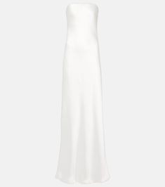 a white dress on a mannequin neckline, with an open back and side slit