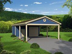 a blue and tan garage sitting on top of a lush green field