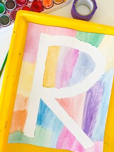 the letter p is painted with watercolors on paper