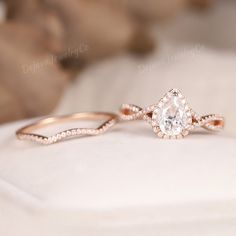 a close up of a diamond ring on a cushion