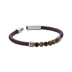 This black leather and tiger's eye beaded bracelet makes a bold fashion statement. Stainless steel This woven leather design features six round tiger's eye beads between two ornate barrel beads 8.5 inches with snap-lock clasp Casual Brown Leather Beaded Bracelets, Brown Beaded Leather Bracelets, Brown Leather Beaded Bracelets, Leather Bracelets With Round Beaded Details, Leather Bracelet With Round Beaded Details, Brown Leather Beaded Bracelets With Round Beads, Beaded Leather Bracelet With Round Beads, Brown Leather Bracelet, Snap Lock