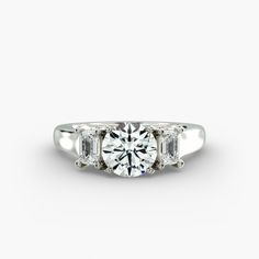 three stone diamond ring on white background