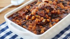 a casserole dish filled with beans and meat