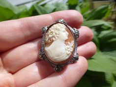 "I adore this antique Victorian cameo brooch. It dates to the 1890s and is done in sterling silver, marked \"Sterling\". It measures 1 1/4'' long by 1'' and so is a good size. It features marcasites for sparkle. Genuine hand carved shell cameo, wonderful piece. Very good antique condition, would make a fabulous brooch to adorn a dress or jacket." Collectible Art Nouveau Hallmarked Brooch, Ornate Cameo Brooch For Anniversary, Art Nouveau Filigree Brooch For Collectors, Collectible Art Nouveau Filigree Brooches, Antique Wedding Brooches, Victorian Brooches For Vintage Events, Victorian Style Collectible Screw Back Brooches, Antique Cabochon Brooches For Anniversary, Antique Engraved Collectible Brooches