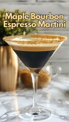 a close up of a martini in a glass on a table with the words maple bourbon espresso martini