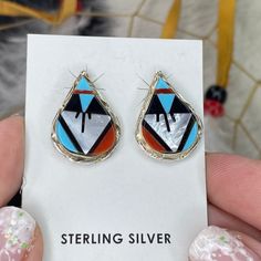 1/2 Price! ZUNI Native American Turquoise Multi-Stone Post Earrings Sterling Silver! Traditional One of a Kind Handmade Zuni Post Earrings!  These teardrop-shaped post earrings feature an inlay of multiple stones Turquoise, Red Coral, Mother of Pearl, Jet all set in sterling silver.  This stone combination is a very traditional Zuni look.   Pair these earrings with Navajo Pearls and your other Native American jewelry. See pics and video for measurements and more details. Each earring weighs appr Navajo Pearls, Zuni Jewelry, Native American Turquoise, American Turquoise, Jewelry Show, American Jewelry, Multi Stone, Earrings Sterling Silver, Red Coral