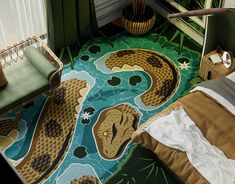 a bedroom with green walls and an area rug that has two snakes on the floor