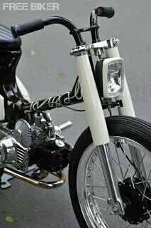 a white and black motorcycle parked on the street