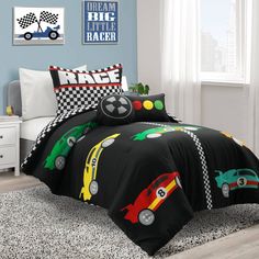 a child's bed with cars on it