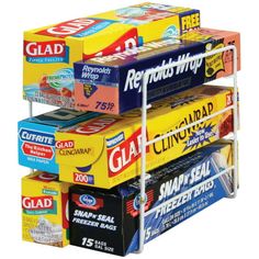 three tiered shelf holding several different types of chewing gums and toothpaste