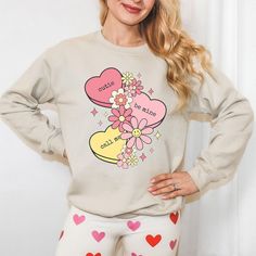 Looking for a cute versatile top to wear this summer? Make sure to grab one of our Cursive Fall Leaf Sweatshirts! This soft and comfortable shirt is the perfect top for any outfit. It can be paired with biker shorts, Jeans, or the classic stay at home sweats! The bright color adds a pop of summer to any outfit. This sweatshirt is true-to-size, so be sure to order your regular size! If you are looking for a more oversized look, make sure to size up. Casual Heart Graphic Top For Loungewear, Spring Heart Print Crew Neck Tops, Trendy Heart Graphic Tops For Loungewear, Trendy Loungewear Tops With Heart Graphic, Trendy Heart Print Tops For Loungewear, Heart Graphic Relaxed Fit Top For Loungewear, Relaxed Fit Heart Graphic Top For Loungewear, Heart Print Crew Neck Top For Loungewear, Relaxed Fit Loungewear Tops With Heart Graphic