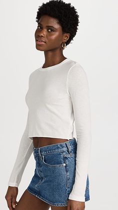 SLVRLAKE Long Sleeve Crop Baby Tee | SHOPBOP Crew Neck Long Sleeve Cotton Top With Thumbholes, Cotton Long Sleeve Crew Neck Top With Thumbholes, Cotton Long Sleeve Top With Thumbholes And Crew Neck, White Long Sleeve Top With Thumbholes For Spring, Long Sleeve Cotton Tops With Thumbholes, Cotton Long Sleeve Tops With Thumbholes, Cropped Long Sleeve Cotton Top For Fall, White Tops With Thumbholes For Fall, Fitted White Cotton Long Sleeve Top