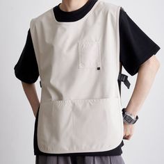 This apron not only serves as a protective garment to prevent dirt and stains but also comes with a range of practical features. It is made of waterproof material to shield your clothes from splashes and spills. The sleeveless design offers freedom of movement, and its reversible feature allows for versatile wearing options. The adjustable side straps provide a customizable fit. The comfortable round collar design adds an extra level of comfort, while the multiple pockets offer convenient storag Reversible Clothing, Work Vest, Restaurant Uniforms, Workwear Brands, Shirt Design Inspiration, Vest Designs, Aprons Patterns, Style Japonais, Apron Designs