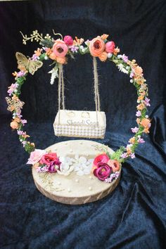 a cake with flowers around it on a table