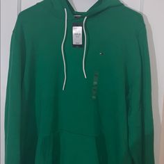 Green Tommy Hilfiger Hoody Casual Green Tommy Hilfiger Tops, Tommy Hilfiger Long Sleeve Hooded Top, Tommy Hilfiger Casual Tops With Drawstring Hood, Casual Tommy Hilfiger Tops With Drawstring Hood, Casual Hooded Top By Tommy Hilfiger, Tommy Hilfiger Casual Hoodie Top, Casual Tommy Hilfiger Hoodie Top, Casual Tommy Hilfiger Hoodie, Tommy Hilfiger Casual Hoodie Sweatshirt