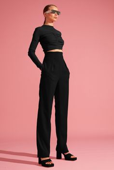 L’MOMO designer trousers. This pair of pants gives you a relaxed yet polished look. The solid wide band cinches your waist to underscore your form, while the clean, minimal pleats let the length of these tapered trousers take the spotlight. Side pockets balance function with style. Match these pants with a cropped blazer or a textured top for a stellar ensemble. Extra Comfort, 2-Way Stretch Double Weave Crepe Breathable Zip Closure Eco-Friendly Made Fabric 85% Polyester, 15% Elastane Care:  Dry Clean Only. Do not bleach Do not tumble dry. Low iron Chic Solid Pants With Pleated Waist, Fitted High-waisted Wide Leg Pants With Pleated Waist, Fitted Wide-leg Pants With Pleated Waist, Chic High Waist Pants With Minimal Stretch, Chic Bottoms With Elastic Waistband And Minimal Stretch, Modern Wide Leg Pants For Night Out, Modern Tapered Leg Pants In Solid Color, Modern Tapered Leg Evening Pants, Sleek Solid Color High Waist Wide Leg Pants