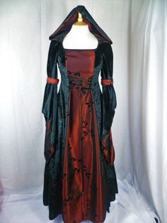 This listing is for a custom made dress,it will be made to your measurements. Please send me your bust,waist and hip measurement,and please measure from the top of your shoulder to the floor with shoes on. Could you also send your bicep measurement thank you. It will be made with beautiful jet black crushed velvet and stunning burgundy and black flocked taffeta. It will have corset style front and back with lacing so you can adjust the dress to fit your body shape. Combined shipping on multiple items. If you purchase express shipping by courier please send me your phone number thank you. Fitted Gothic Gown For Fancy Dress, Gothic Fitted Gown For Fancy Dress, Vintage Fitted Gown For Halloween, Vintage Fitted Halloween Gown, Fitted Gothic Ball Gown, Fitted Medieval Dress For Fantasy Events, Fitted Witchy Medieval Dress For Fantasy Events, Fitted Prom Dress For Halloween, Fitted Dress For Halloween Prom