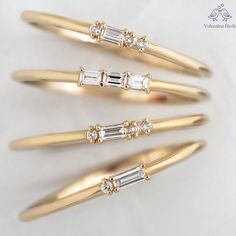 four different types of gold and diamond hair pins