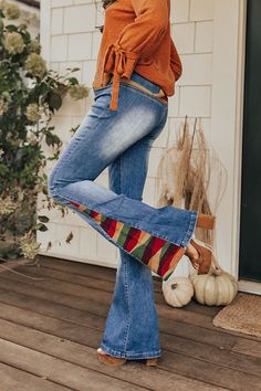 Stay groovy this fall with our 'Amy' pants featuring a medium wash denim material with accent fading and a colorful embroidery design on the back and down the flares! These retro bottoms will take you from season to season, it has a hidden zip fly with a button closure and belt loops, two pockets in the front, none in the back, and a very flattering silhouette that ends in straight floor-length hemlines. Measurements S : Front Rise 10", Hip 30", Inseam 33.5", Length 43", Waist 24". M : Front Ris Stay Groovy, Colorful Embroidery, Denim Material, Model Fits, Hip Length, Bell Bottom Jeans, Embroidery Design, Floor Length, Embroidery Designs