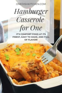 a casserole dish with meat and cheese in it is being eaten by a fork