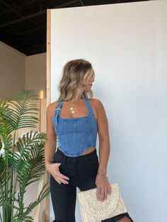 Details Denim Halter Neck Corset Bodice Top with Adjustable Buckle and Back Zipper Closure Color: Denim Material: 70% Cotton/38% Polyester/2% Spandex Size Runs True to Size Model is Wearing a Size Small Model Measurements Size: 4 Height: 5'2" Weight: 135lbs Bust: 35" Waist: 26" Hips: 35" Bra Size: 34C Denim Halter Top Outfit, Jean Corset Top Outfit, Denim Tank Top Outfit, Denim Top Outfit, Halter Neck Corset, Halter Tops Outfit, Jenny From The Block